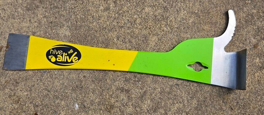 HiveAlive EZ Find Pro hive tool showing the yellow and green handle and stainless steel J-hook